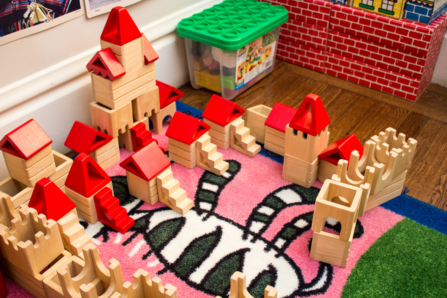 Block castles on the play rug — inside the Shining Stars classroom.